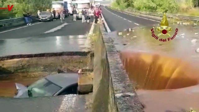Car Swallowed by Giant Sinkhole in Flooded Italy