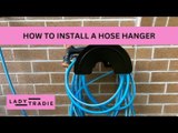 Woman Drills Screws to Hang Her Hose Hanger