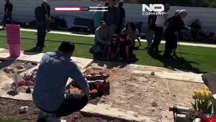 Mourners take cover at cemetery in northern Israel during rocket attack from Lebanon