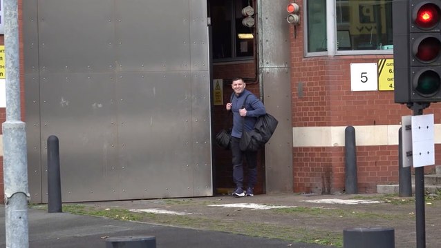 Prisoners celebrate as they walk free from jail on day government releases inmates early to ease overcrowding