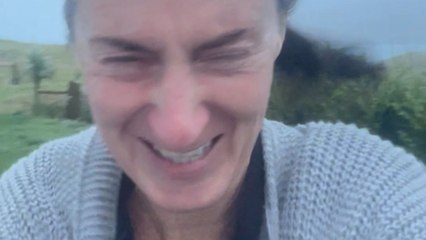 Daring woman stands in the danger zone to capture Storm Ashley's fierce winds on video