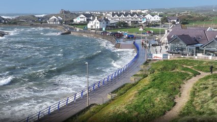Dramatic drone footage shows waves crashing on Anglesey coast as Storm Ashley hits North Wales