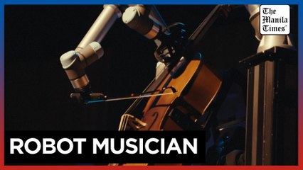 Robot plays cello with a symphony orchestra in Sweden