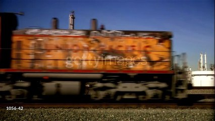 gettyimages-1056-42-640_adppMS locomotive passing oil refinery, Los Angeles, California, USA - HD stock video