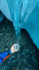 "Next Level Hydration Inside An Alaska  Glacier Cave With a Tunnel Through The Roof Follow For More Videos Have Virelreels"...!!