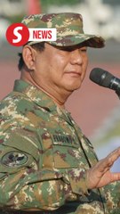 With green camo and combat boots, Indonesia's new cabinet kicks off army retreat