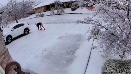 Cold conundrums: Man struggles to stay upright on slippery stage of nature