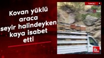 Tunceli'de kovan yüklü araca seyir halindeyken kaya isabet etti