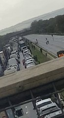 Pedestrians play football after M5 shuts due fire