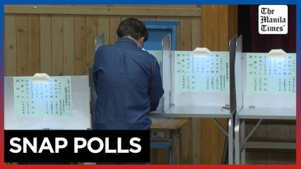 Japan's ruling party falls short of majority in tightest vote in years