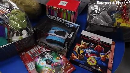 'Halloween Queen' Surinder Mann hands over money to the Children's Ward at New Cross Hospital.