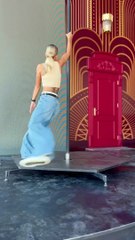 Performer does an acrobatic spinning stunt on a pole!