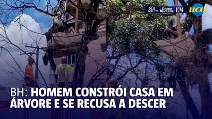 Bombeiros tentam tirar homem que fez casa em árvore na Contorno