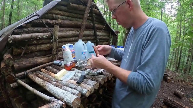 Bushcraft Log Cabin Camping in Rain Storm - Repairing and upgrading my survival shelter with my son