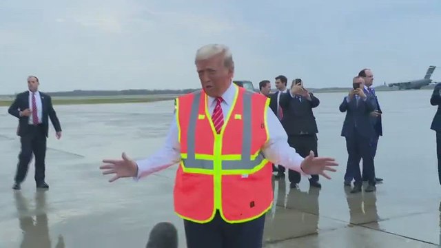 Donald Trump close to a fall before climbing into garbage truck to face reporters
