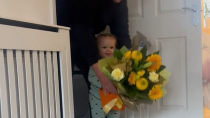 Baby girl takes over a bouquet that is meant for someone else