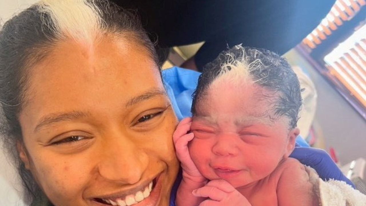 Mum stunned after newborn daughter born with matching white hair streak