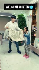 "Overprotected: When Dad Turns Winter Layers into a Baby Fashion Show!"