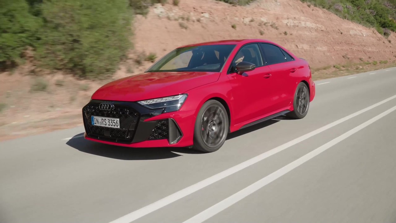 The new Audi RS 3 Sedan in Progressive red Driving Video