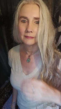 Beautiful long curly tailbone length hair.