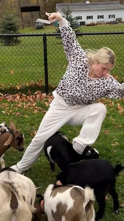 Woman Trips Over Baby Goat and Falls