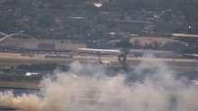 Sydney airport fire: Qantas 'engine malfunction' ignites grass fire