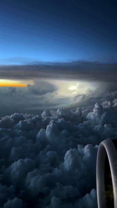 Storm from Above! ✈️🌩️ A breathtaking view of a massive storm as seen from a plane, calm and serene from above but raging with lightning and thunder below. Nature’s beauty and power in perfect contrast.