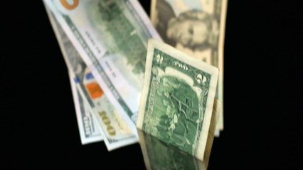 mixkit-banknotes-falling-on-a-dark-background-18305-full-hd (1)