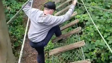 Boy's thrill of adventure fades as wooden bridge gives way suddenly