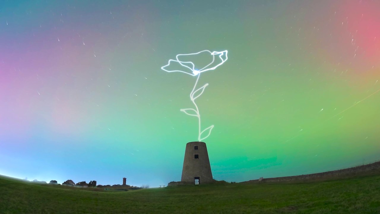 Beautiful 300ft high poppy display set against Northern Lights