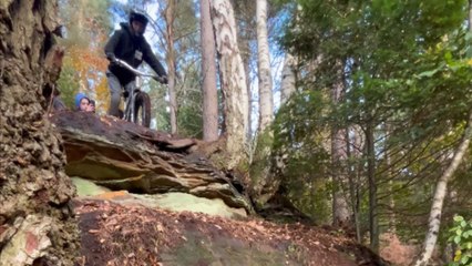 Mountain biker attempts double drop but ends up losing control mid-descent