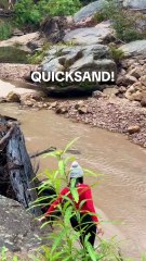 Woman steps in quicksand not realizing it s quicksand!