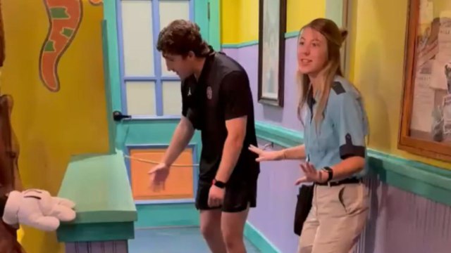 Little girl meets Mickey and Minnie Mouse for the first time and hugs them