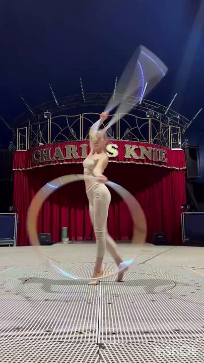 Circus performer is showing her skills with hula hoops!