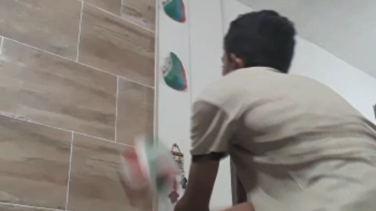 Boy plays volleyball for a high school activity but ball hits ceramic décor