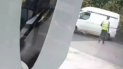 Sloppy driver puts his van and a man at risk for a lamppost