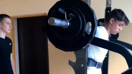 Fitness enthusiast attempts squat max but can't handle the weight on his neck