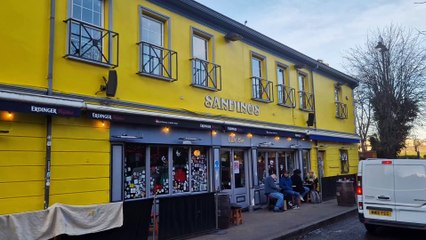 Derry Sandino's bar repainted to its iconic yellow