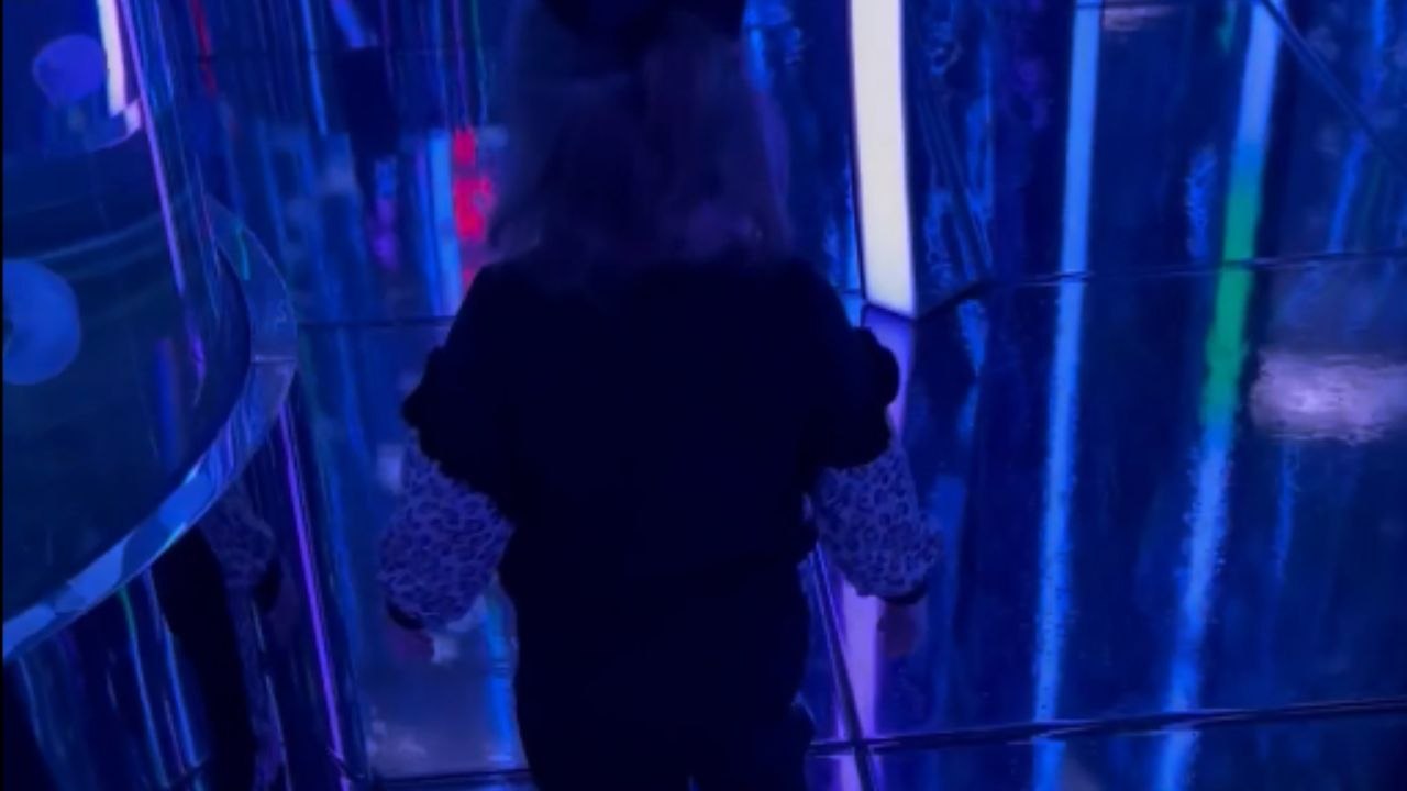 Little girl navigates mirror maze and collides...