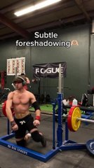 Man attempts barbell squat