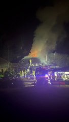 Firefighters extinguish a house fire in Churt