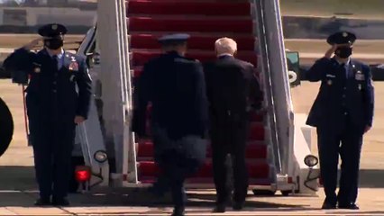 Wide Biden trips to the stairs