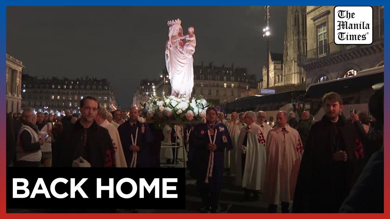 Candle procession returns Virgin Mary statue to rebuilt Notre-Dame Cathedral