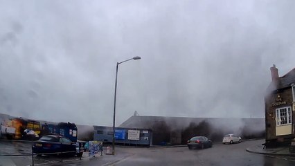 Huge Wave Strikes Coastal Wall in Newlyn, Cornwall and Drenches Passing Vehicle