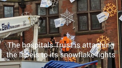 Attaching the biggest Christmas labels in Sheffield