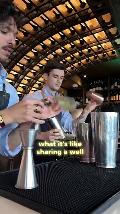 Coworkers are bartending effortlessly together!