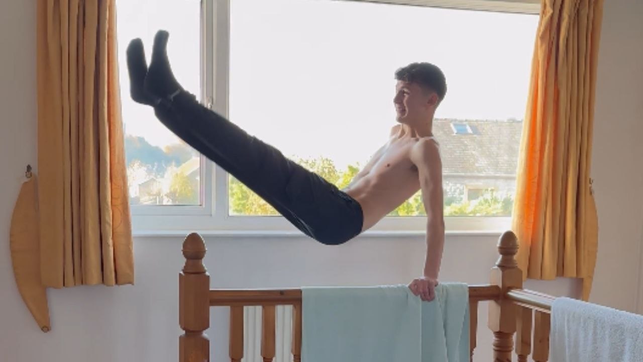 Boy’s swinging on the bannister ends in a flip after his hand slips
