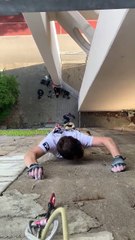 Man is climbing one of Berlin s gnarliest urban concrete rock faces on the outside of a WW