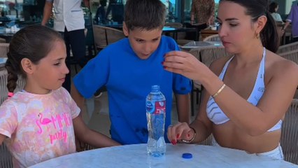 Girl balances an egg on water bottle and surprises kids with a prank