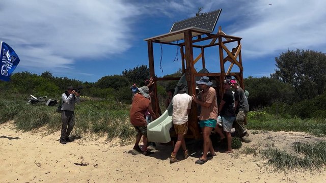 Protesters carry a pontoon onto the beach ahead of the flotilla launch in Newcastle Newcastle Herald | November 22, 2024